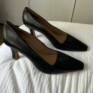 Black leather pumps